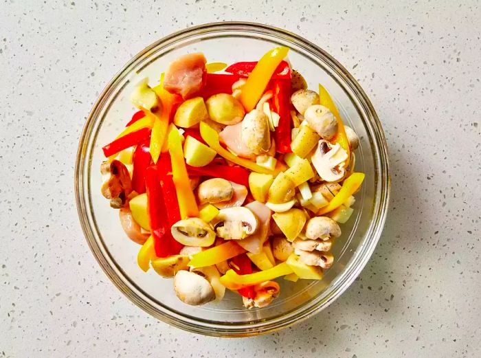 All ingredients are mixed together in a bowl, ready for cooking.