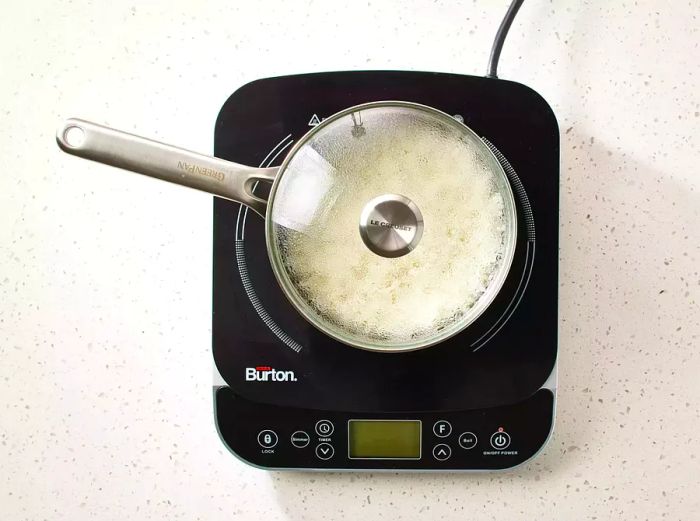 Sweet Coconut Rice in a covered saucepan on the stove