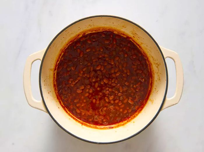 Completed baked beans in a pot, ready to serve.