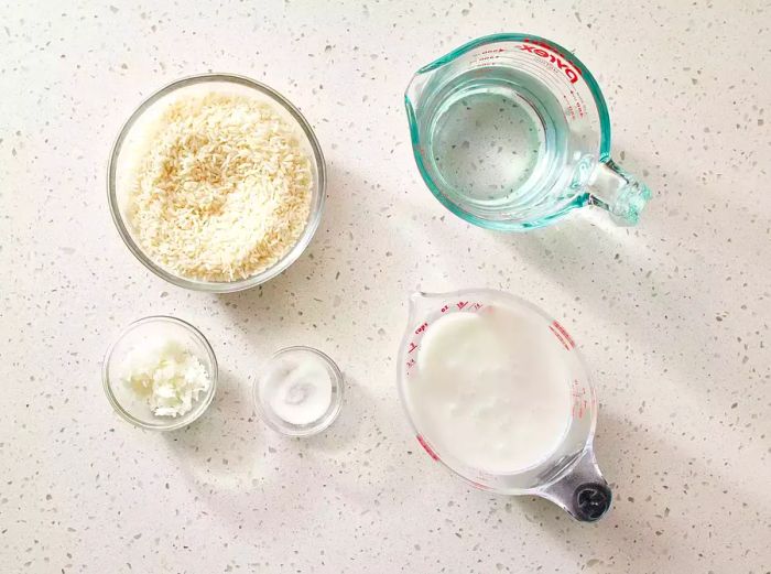 Ingredients for Sweet Coconut Rice displayed on a kitchen counter