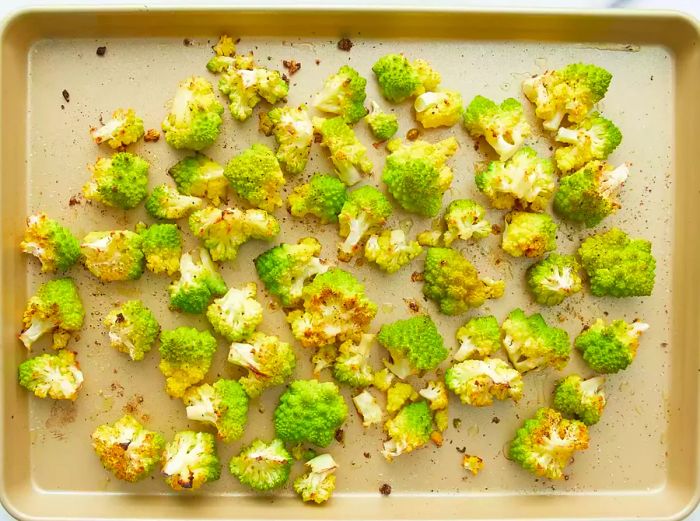 A top-down view of roasted Romanesco on a baking sheet.