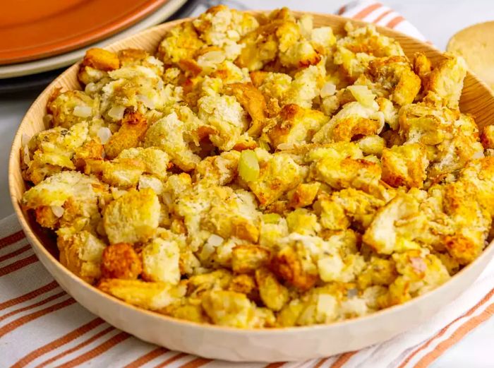 A high-angle shot of freshly baked old-fashioned stuffing served in a bowl.