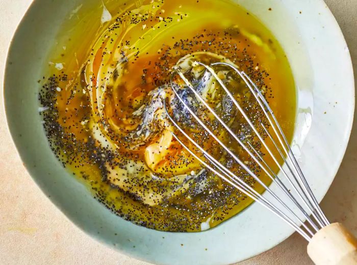 Whisk together butter, Dijon mustard, Worcestershire sauce, poppy seeds, and dried onion in a bowl.