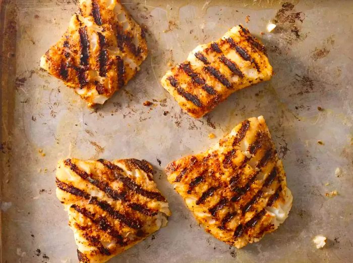 grilled cod fillets resting after being removed from the grill