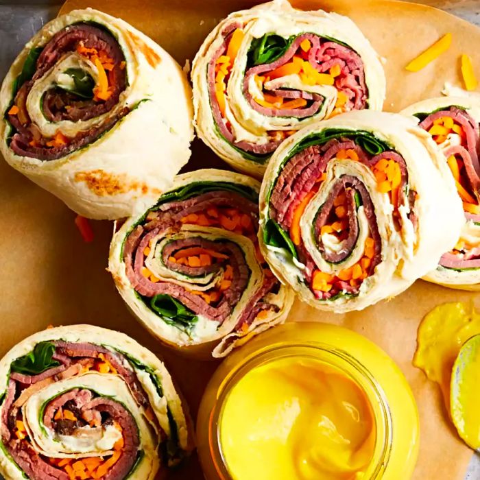 Roast Beef Horseradish Roll-Ups served on parchment paper