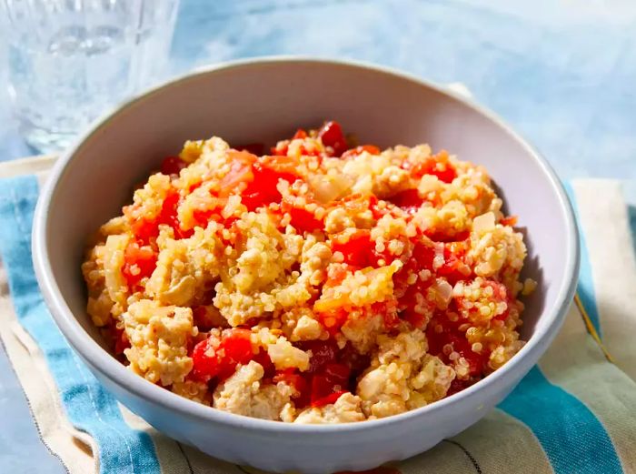 A bird's-eye view of a quinoa chicken dish served in a bowl