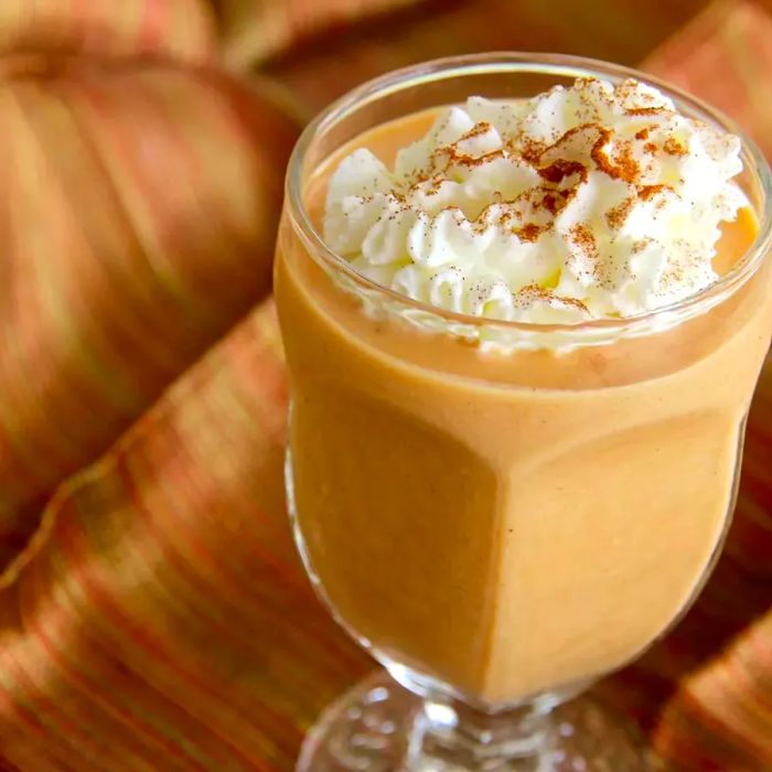 Pumpkin Pie Smoothie for Two topped with a dollop of whipped cream