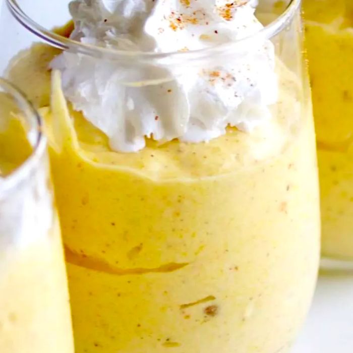 Quick and Easy Pumpkin Mousse served in glasses topped with whipped cream