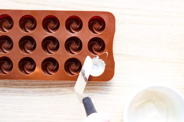 lining your chocolate molds with a layer of melted white chocolate