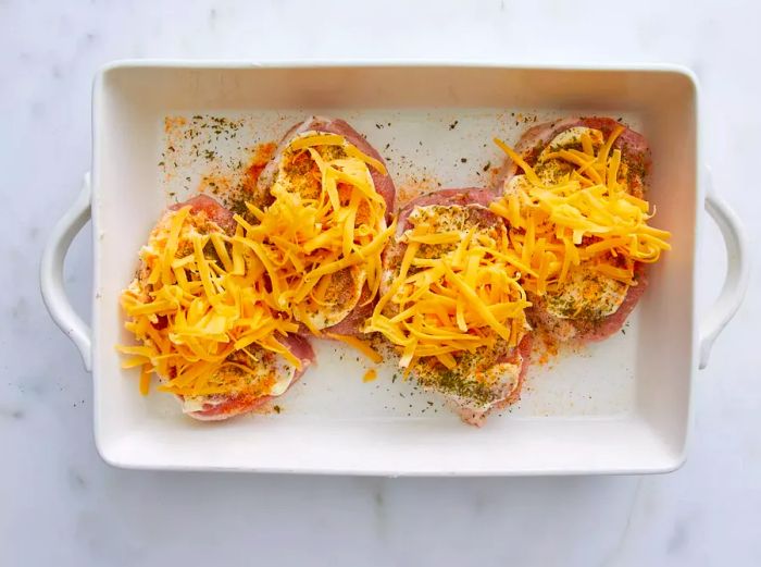 Pork chops seasoned with a blend of cheese, parsley, and spices