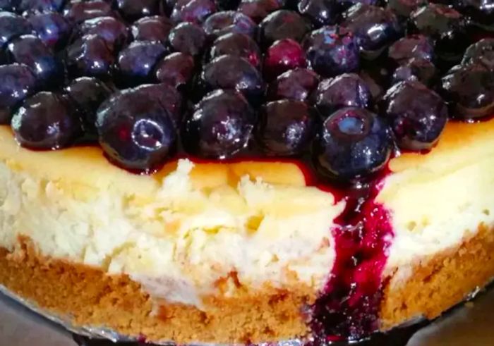 Lemon Souffle Cheesecake topped with fresh blueberries