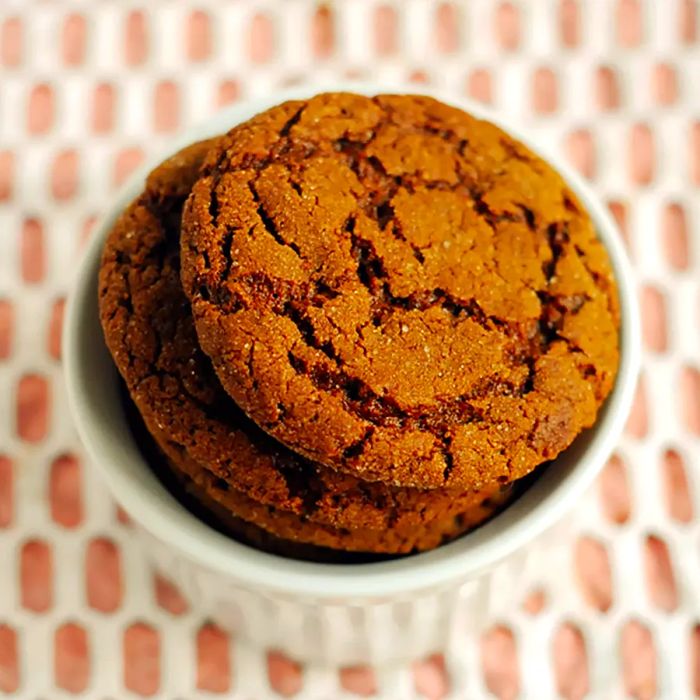 A close-up view of ginger cookies in a white bowl