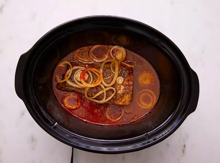 The brisket should be cooked until it is tender and easily shredded.