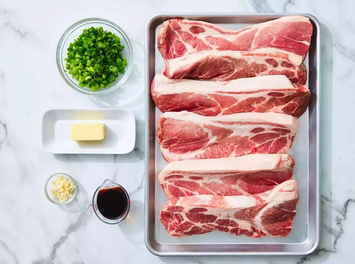 All ingredients ready for preparing pork steaks