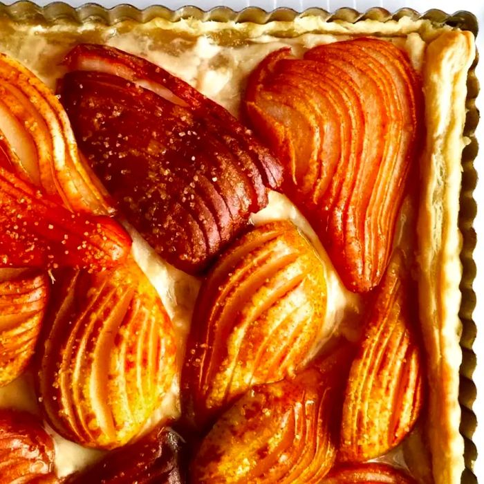 A pear tart baked in a square pan