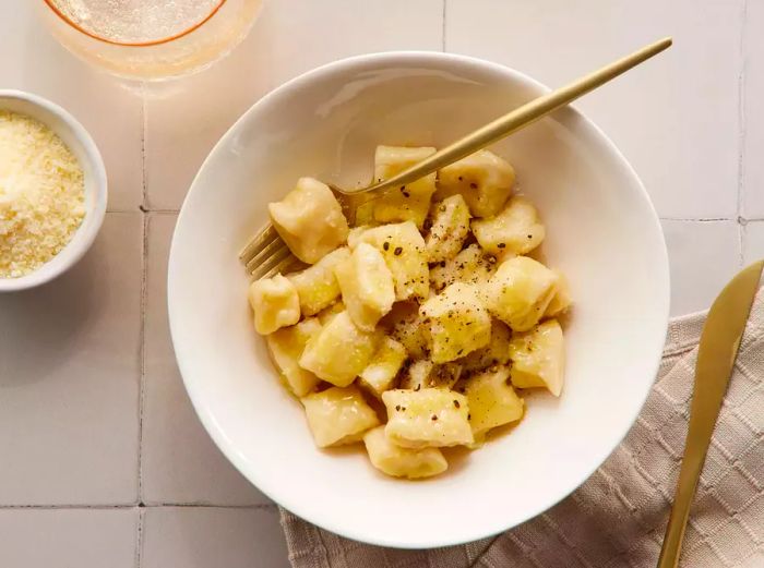 a close-up view of a bowl filled with gnocchi