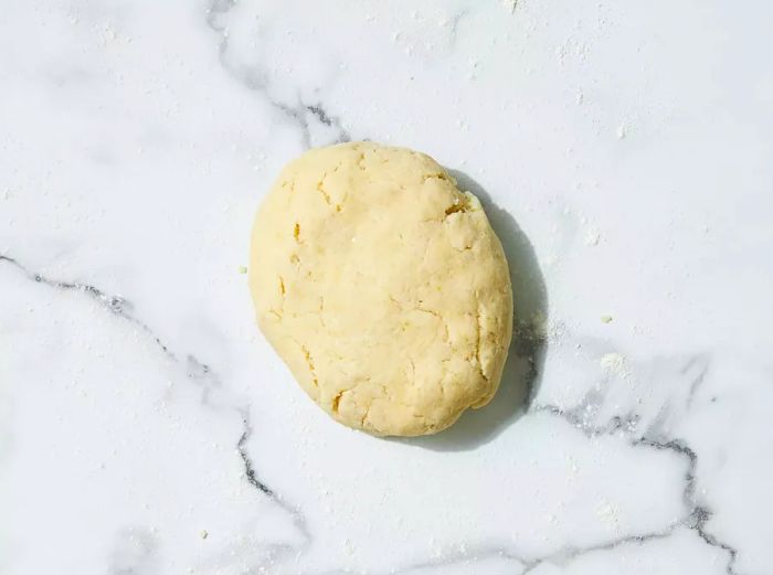 flour, egg, and salt mixed with potatoes to form a dough