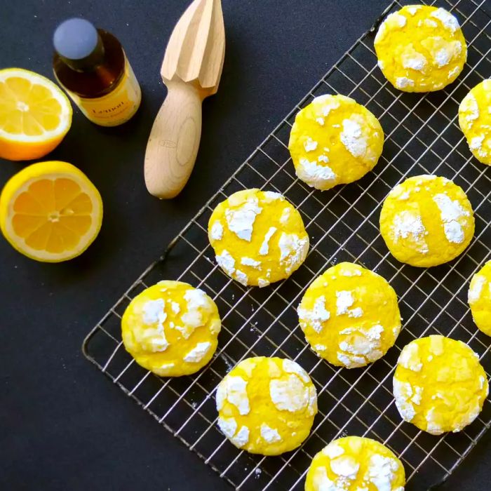 A view from above of a cooling rack filled with lemon crinkle cookies