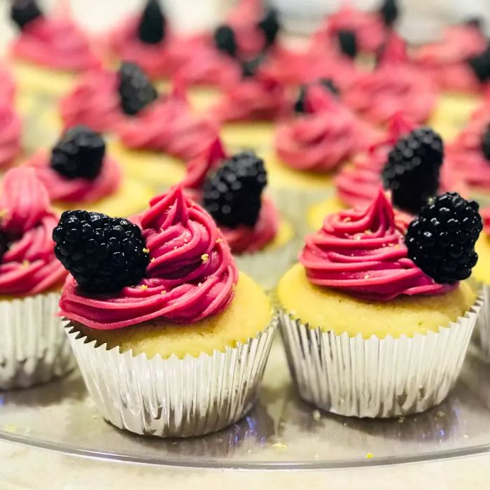 Lemon Cupcake topped with Blackberry Buttercream