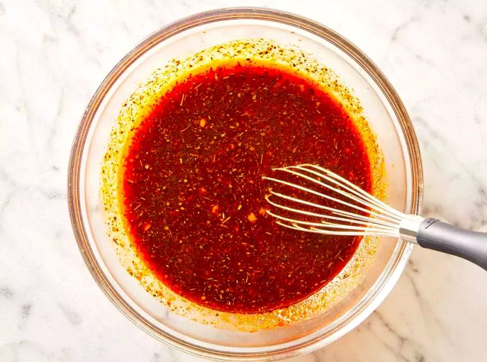 top view of mixed marinade for pork chops in a bowl