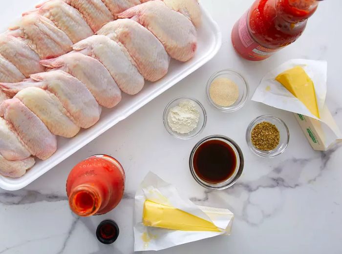 A bird's-eye view of all the ingredients for Savory Slow Cooker Buffalo Wings