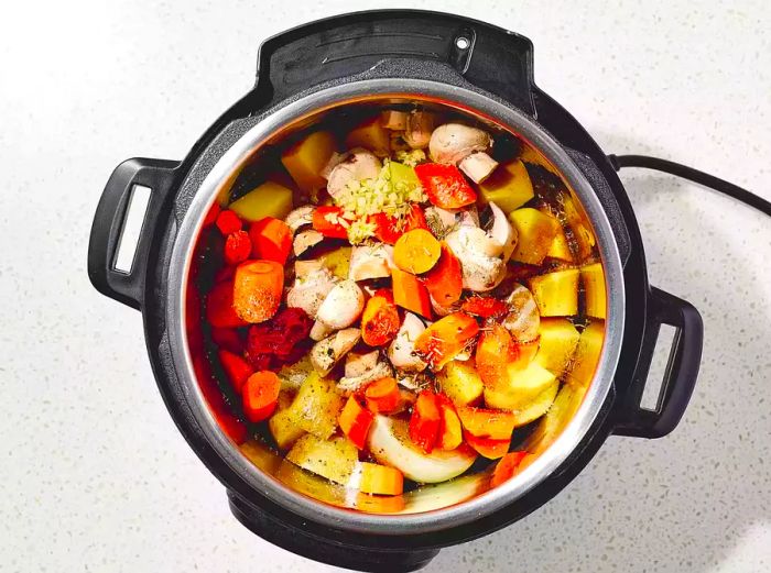 Spices and seasonings added to the pot.