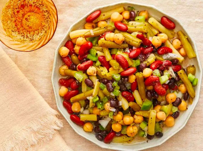 Gazing down at a large bowl of delicious bean salad