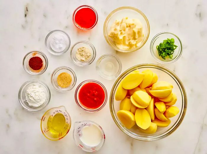 All the ingredients for making bang bang potatoes neatly arranged on the kitchen counter.