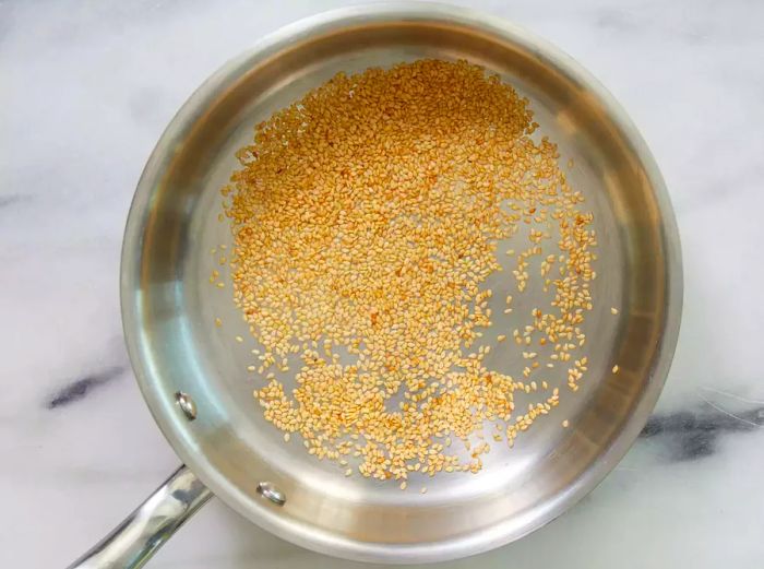 Toast sesame seeds until they turn golden brown and aromatic.