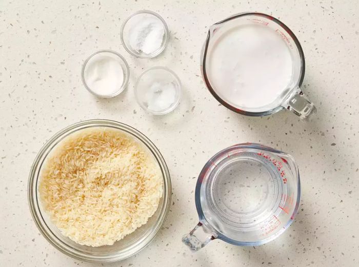 Ingredients for Asian Coconut Rice displayed on a clean white counter