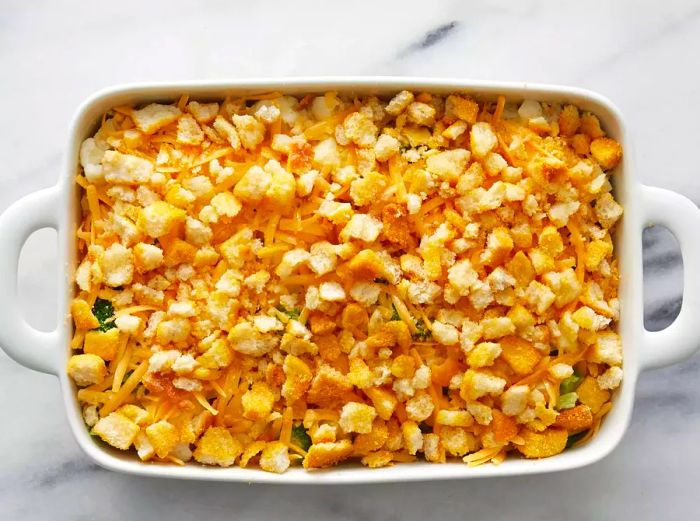 A top-down view of a prepared broccoli cauliflower casserole