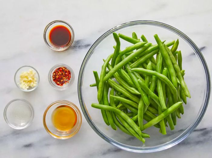 A bird's-eye view of all the ingredients for spicy air fryer green beans