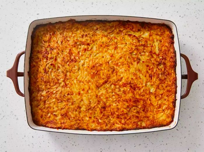 An aerial view of the perfectly baked potato kugel in the dish