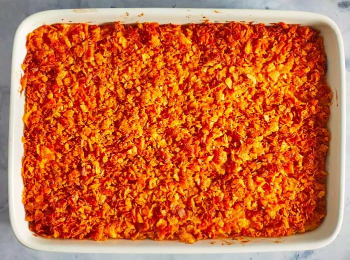 An overhead view of the baked potato casserole with a crispy cornflake topping.