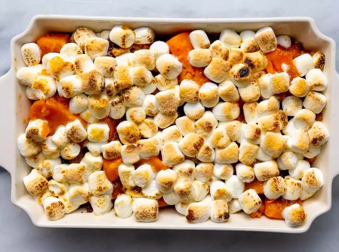 Aerial view of the baked candied yams in a baking dish.