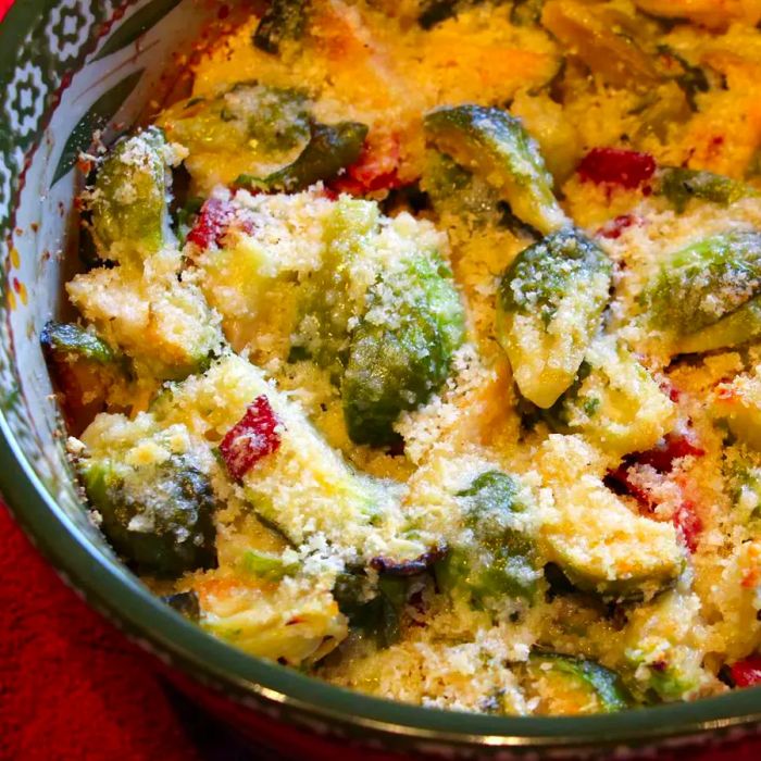 A close-up shot of Brussels Sprouts Gratin served in a bowl, topped with melted cheese.