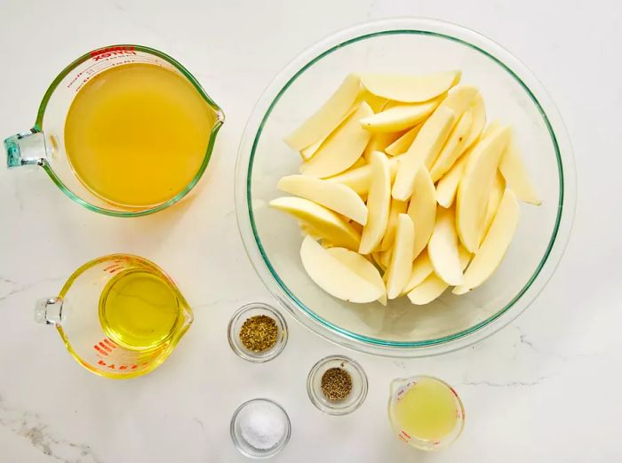 all the ingredients needed to prepare Greek-style lemon roasted potatoes