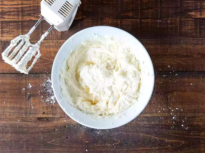 Cream cheese frosting in a mixing bowl