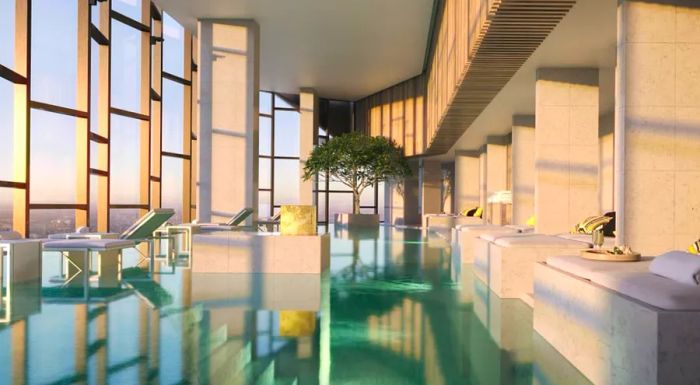 The Ritz-Carlton Melbourne features a heated infinity pool surrounded by floor-to-ceiling windows offering stunning city views.