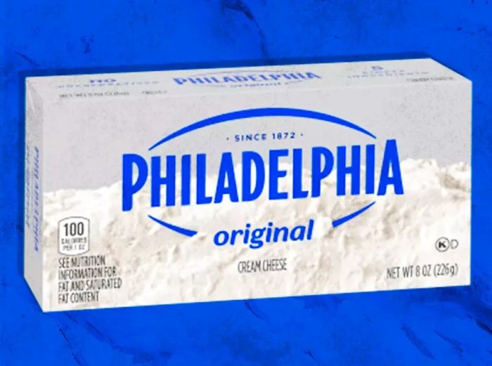 Package of Philadelphia cream cheese against a blue background