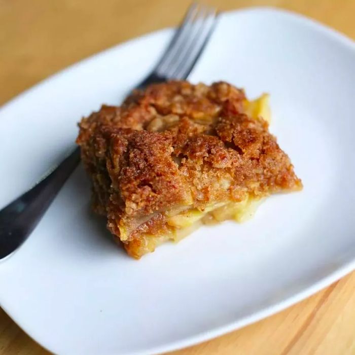 Apple cobbler crumble served on a white plate