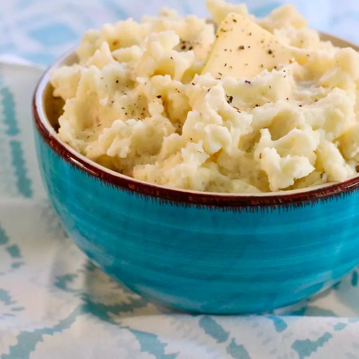 Mashed potatoes served in a turquoise bowl