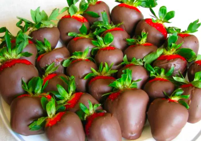 A tray filled with homemade chocolate-covered strawberries.