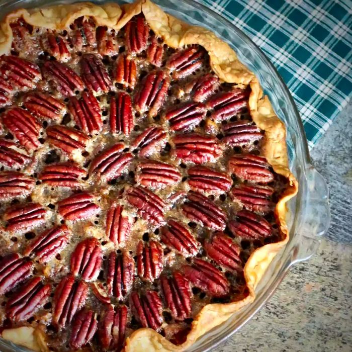 Chocolate Bourbon Pecan Pie served in a glass pie dish