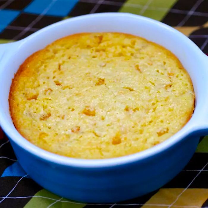 Corn casserole served in a blue dish