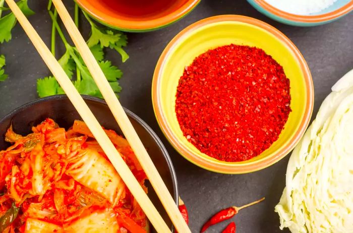 Kimchi and gochugaru in bowls