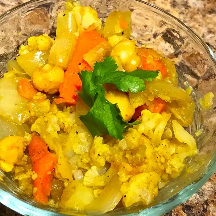 A top-down view of a bowl filled with Indian vegetable bhaji.