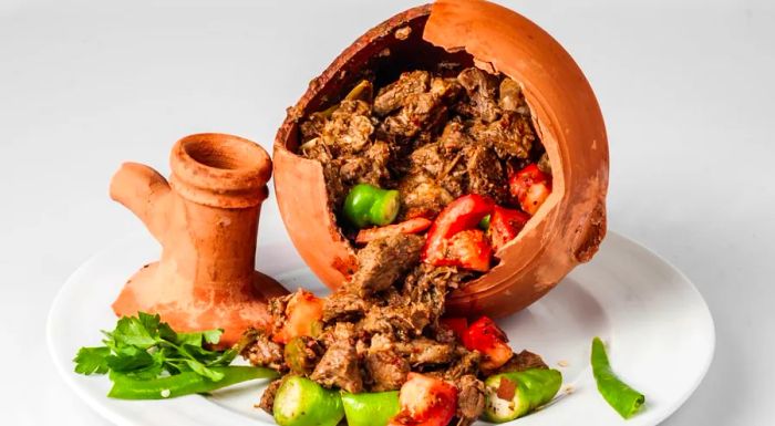 Testi Kebab is a meat and vegetable dish that must be broken open before it can be enjoyed.