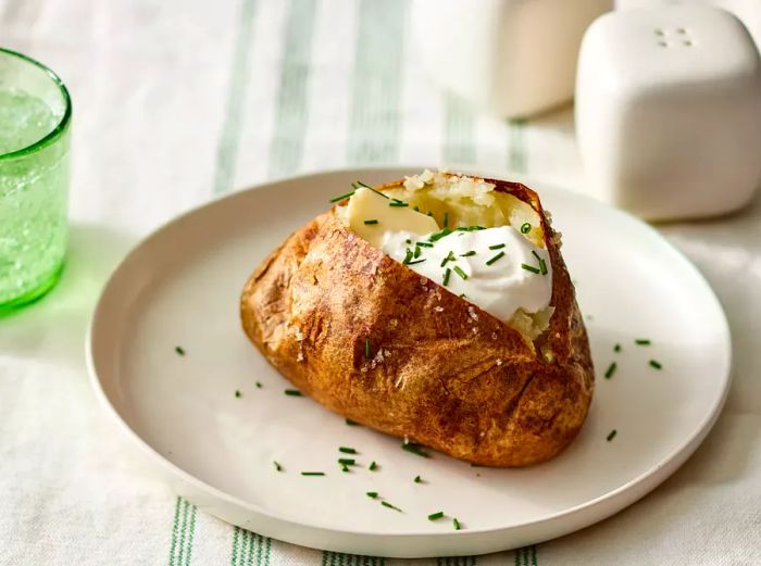 Potatoes cooked to perfection and topped with butter and sour cream