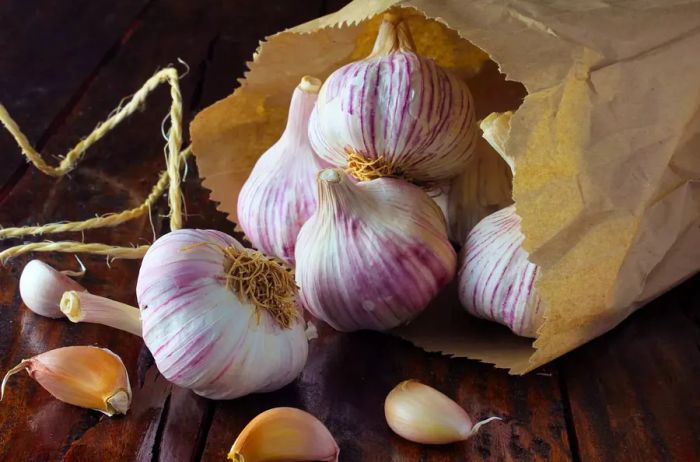 garlic bulbs placed in a paper bag